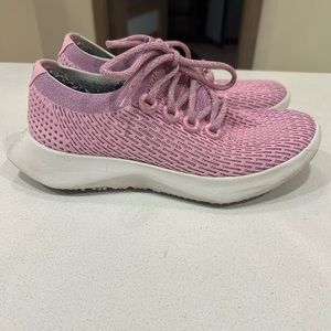 Allbirds pink sneakers.